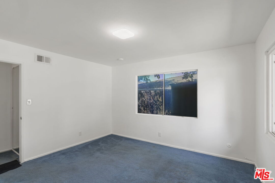 5279 Falkirk Avenue Riverside, CA 92506 - Photo 23 of 44 an empty room with windows