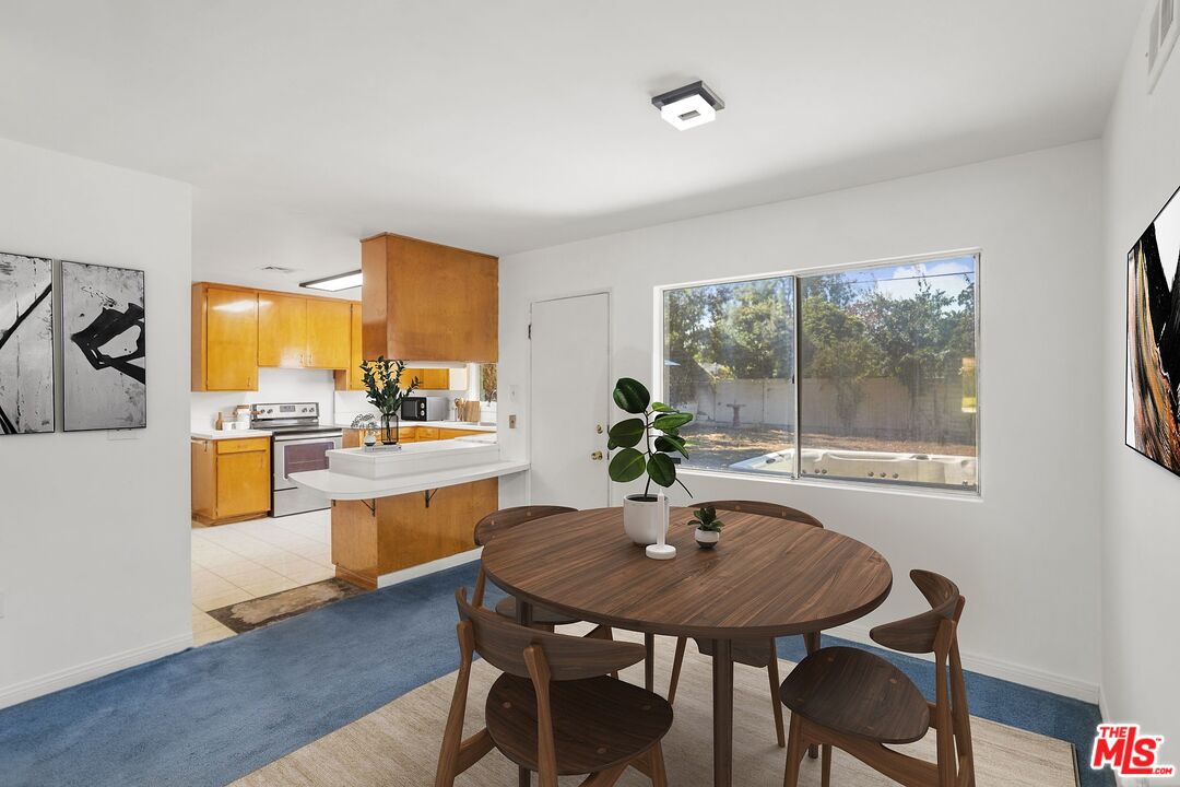 5279 Falkirk Avenue Riverside, CA 92506 - Photo 6 of 44 a view of a dining room with furniture window and outside view