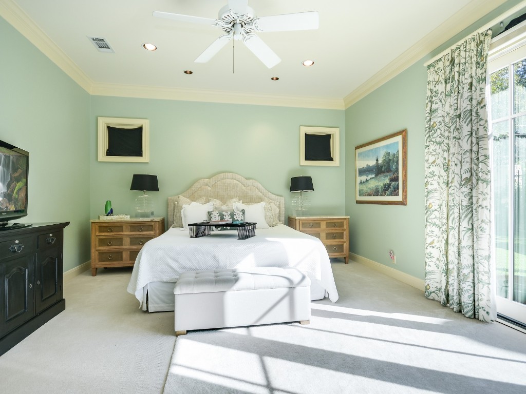 2510 West 35th Street Austin, TX 78703 - Photo 12 of 25 a bedroom with a bed and wooden floor