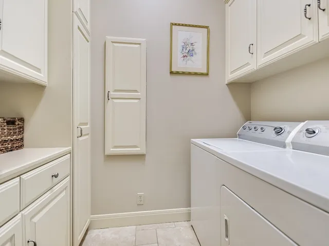 a view of storage and utility room with washer and dryer
