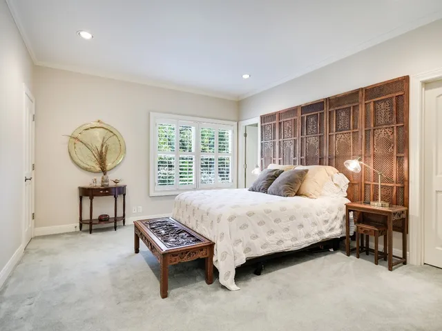 a bed room with a bed and a table