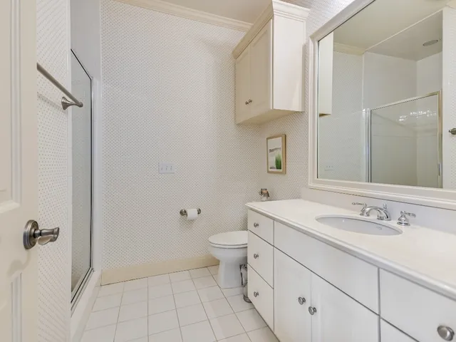 a bathroom with a sink toilet and vanity