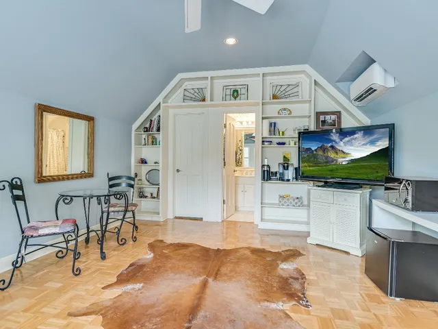 a living room with stainless steel appliances kitchen island granite countertop furniture and a kitchen view
