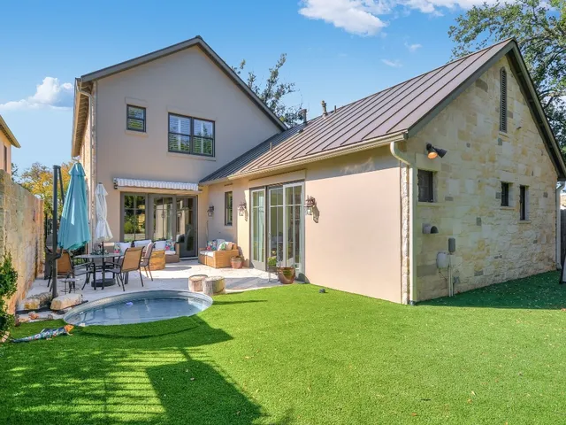 a front view of house with yard and outdoor seating