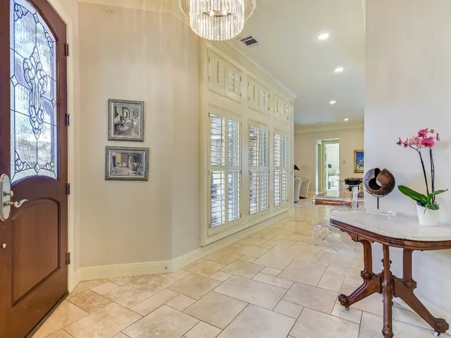 a view of a livingroom with furniture and a window