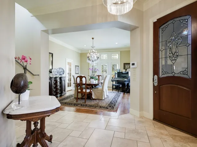 a view of a livingroom with furniture and a chandelier