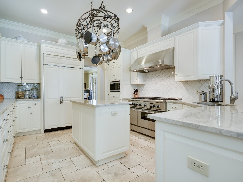 2510 West 35th Street Austin, TX 78703 - Photo 8 of 25 a kitchen with stainless steel appliances granite countertop a sink a stove a refrigerator and cabinets