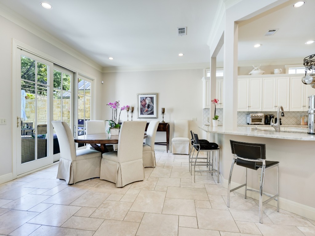 2510 West 35th Street Austin, TX 78703 - Photo 10 of 25 a living room with couches and kitchen view with wooden floor