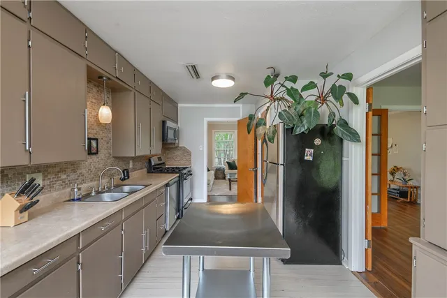 a bathroom with a sink a vanity and a mirror