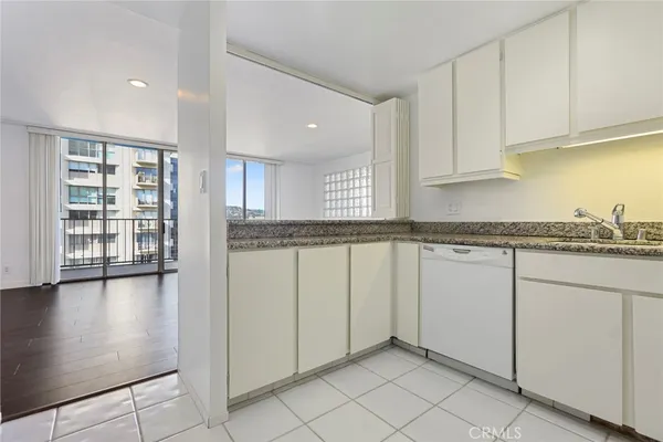 a view of a kitchen with granite countertop cabinets and a sink