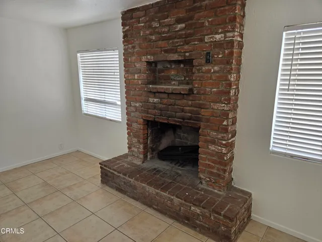 a living room with a fireplace