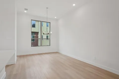 a view of an empty room with glass door