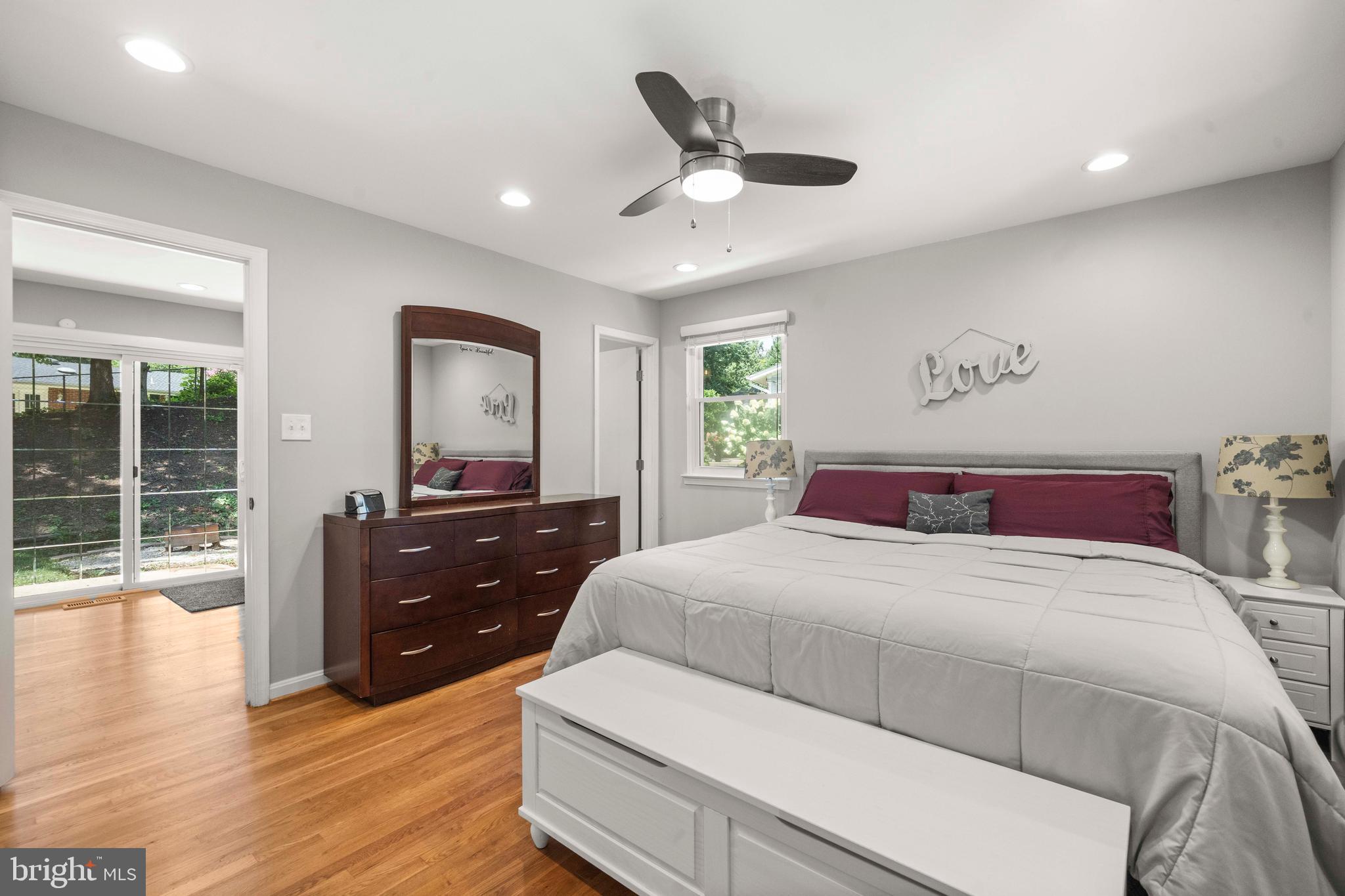 8414 Thames Street Springfield, VA 22151 - Photo 20 of 45 a bedroom with a bed and wooden floor
