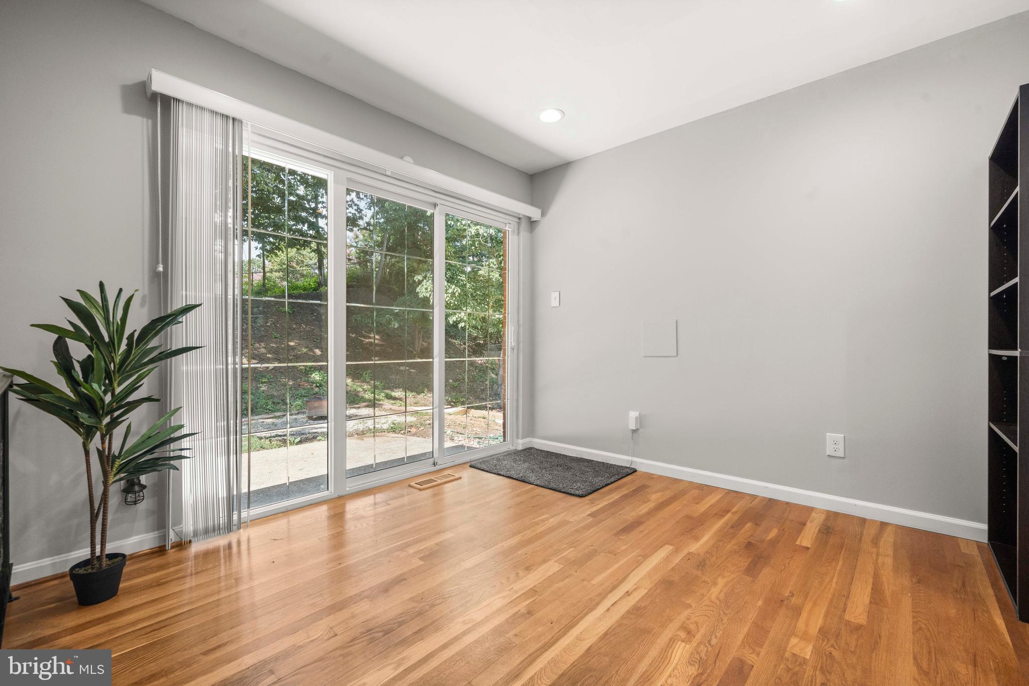 8414 Thames Street Springfield, VA 22151 - Photo 30 of 45 a view of empty room with wooden floor and fan