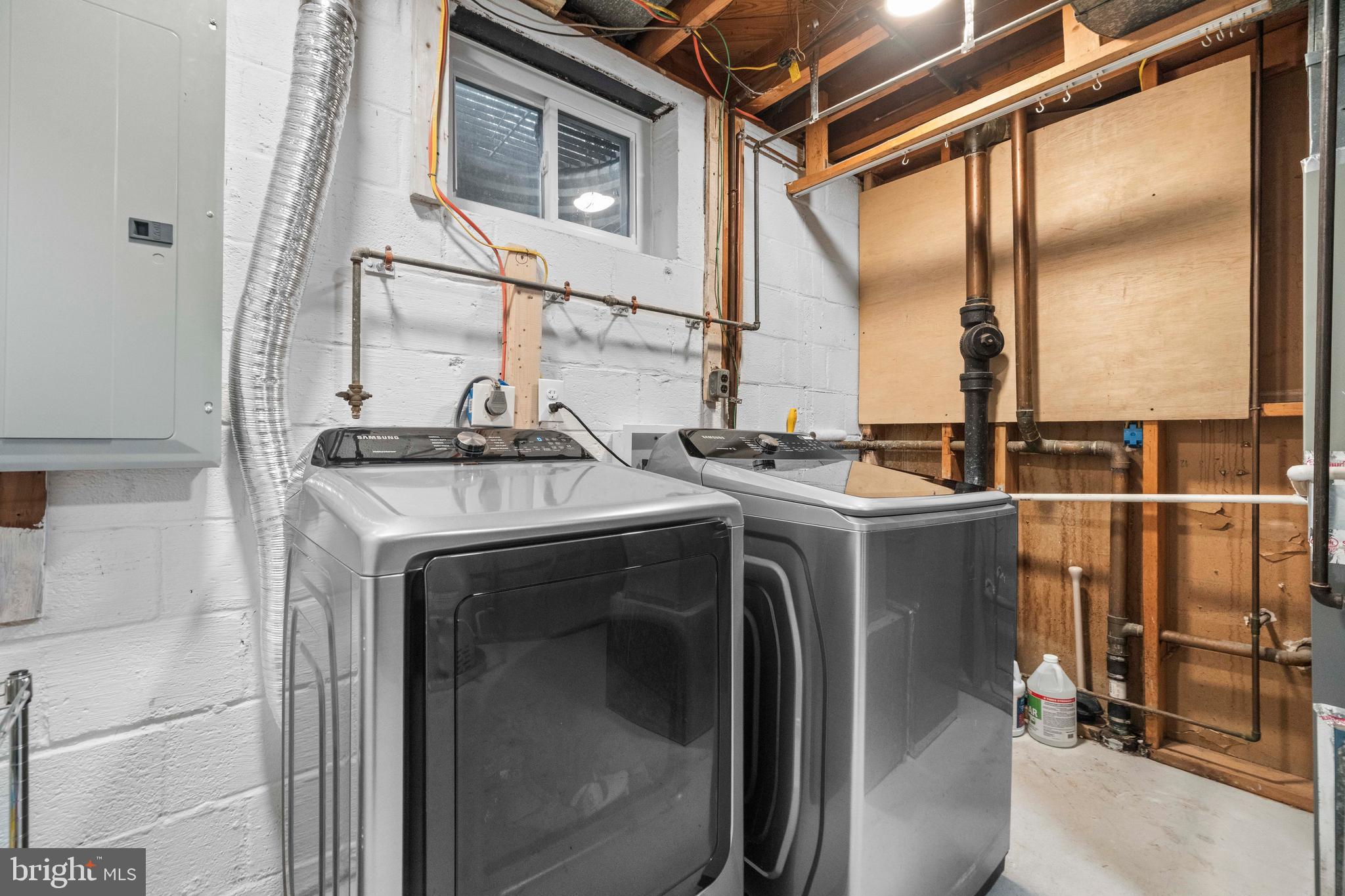 8414 Thames Street Springfield, VA 22151 - Photo 32 of 45 a utility room with dryer and washer