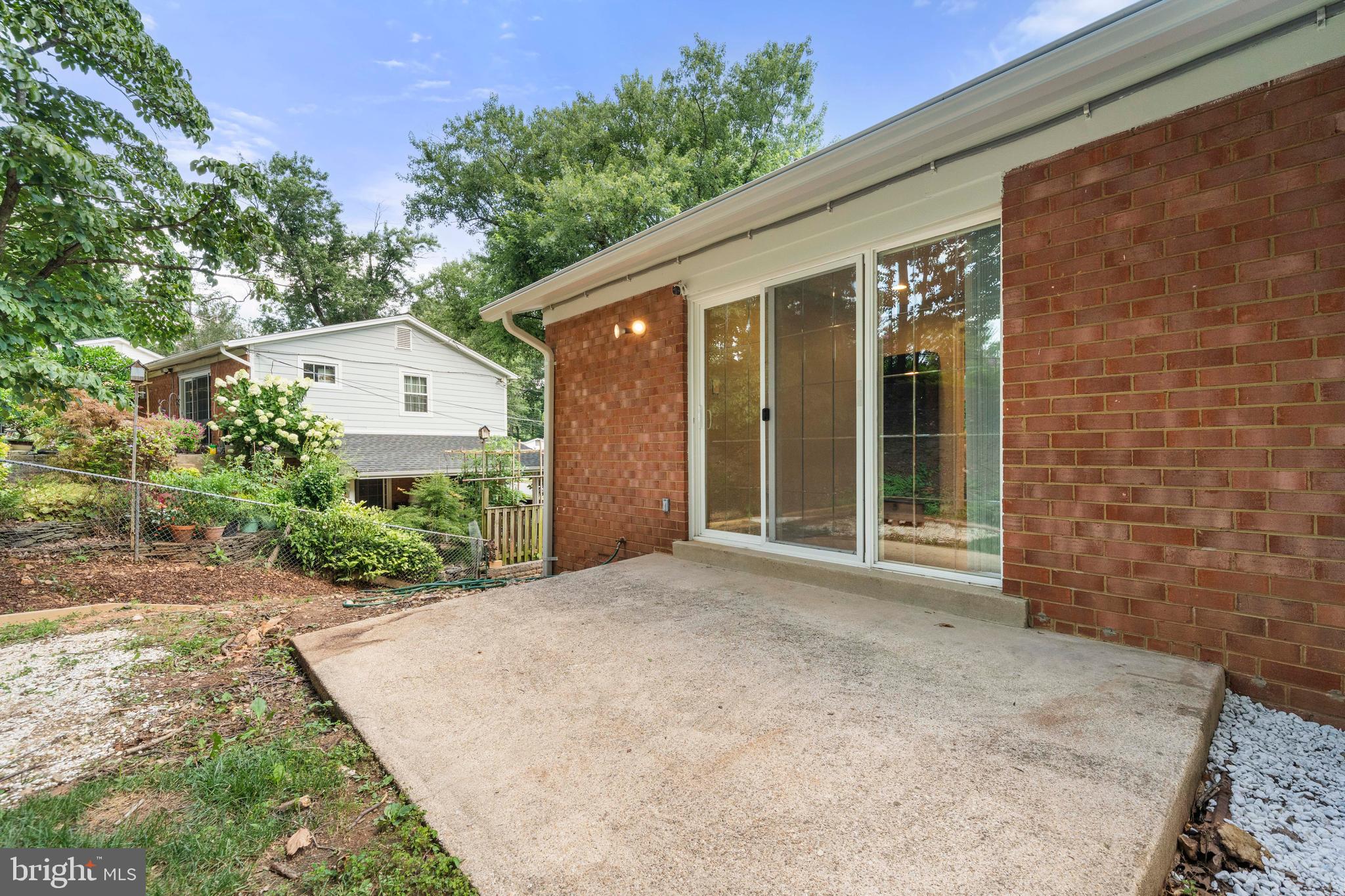 8414 Thames Street Springfield, VA 22151 - Photo 36 of 45 a view of backyard with potted plants and a bench
