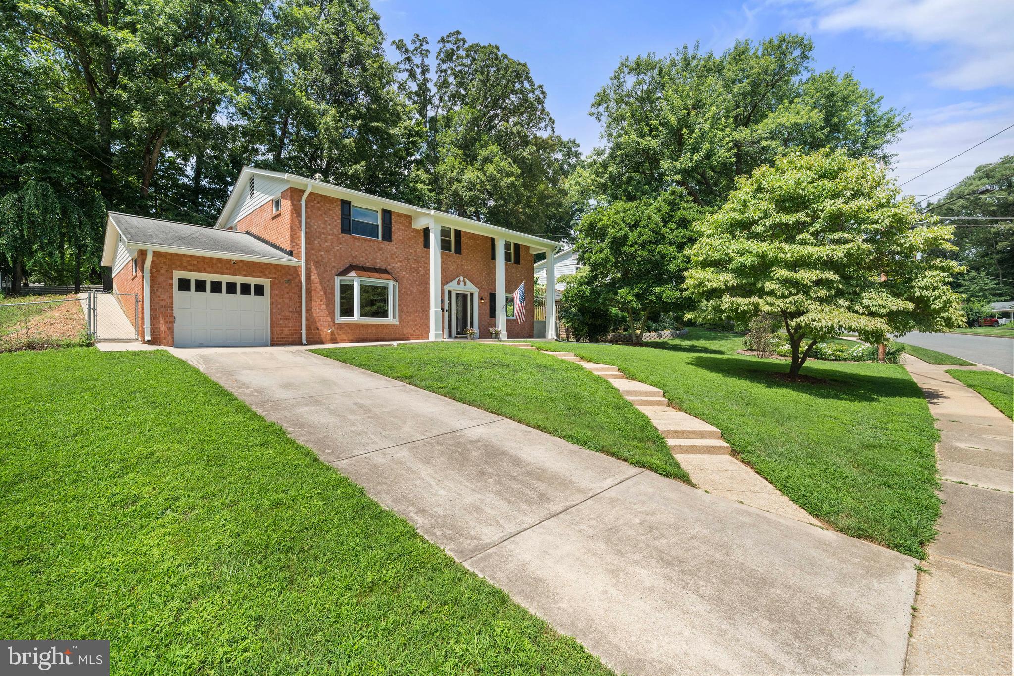 8414 Thames Street Springfield, VA 22151 - Photo 43 of 45 a front view of a house with a yard