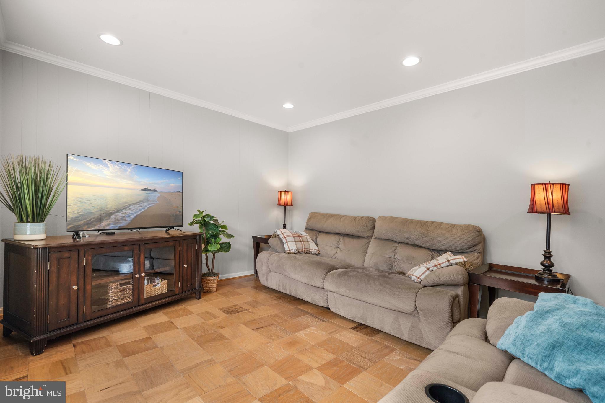 8414 Thames Street Springfield, VA 22151 - Photo 7 of 45 a living room with furniture and a flat screen tv