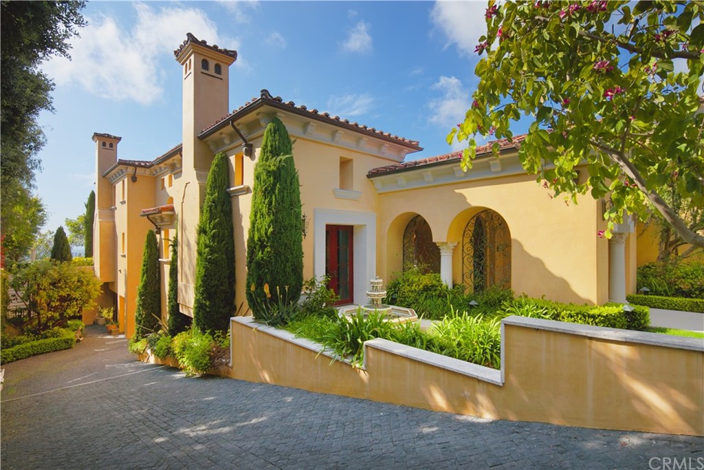 3 Tidecrest Newport Coast, CA 92657 - Photo 12 of 37 a front view of a house with a garden