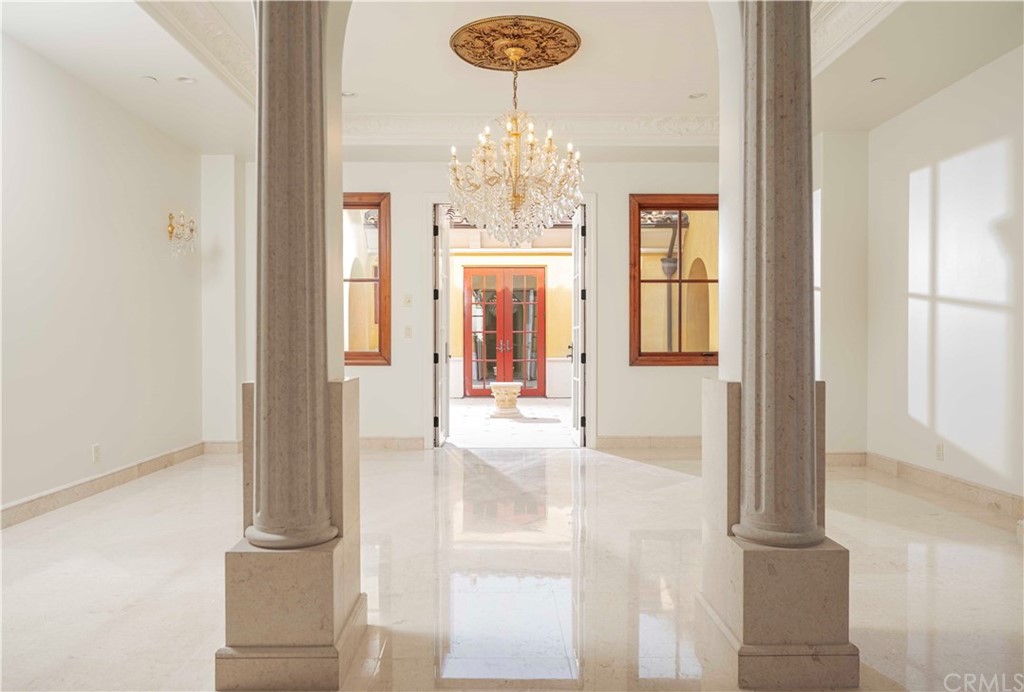 3 Tidecrest Newport Coast, CA 92657 - Photo 17 of 37 a view of a hallway with windows and chandelier