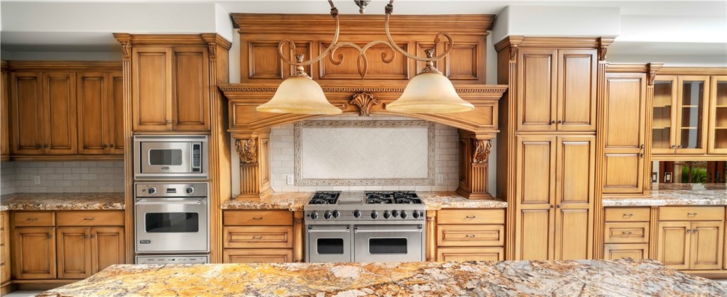 3 Tidecrest Newport Coast, CA 92657 - Photo 21 of 37 a kitchen with stainless steel appliances granite countertop a refrigerator and stove