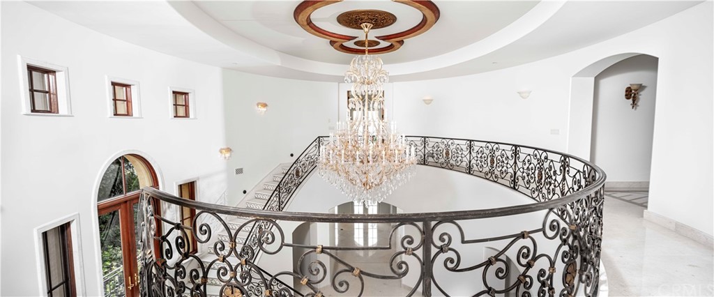 3 Tidecrest Newport Coast, CA 92657 - Photo 27 of 37 a view of entryway with a table and chandelier