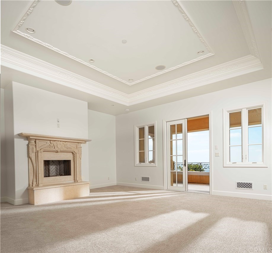 3 Tidecrest Newport Coast, CA 92657 - Photo 31 of 37 a living room with a fireplace furniture and a large window