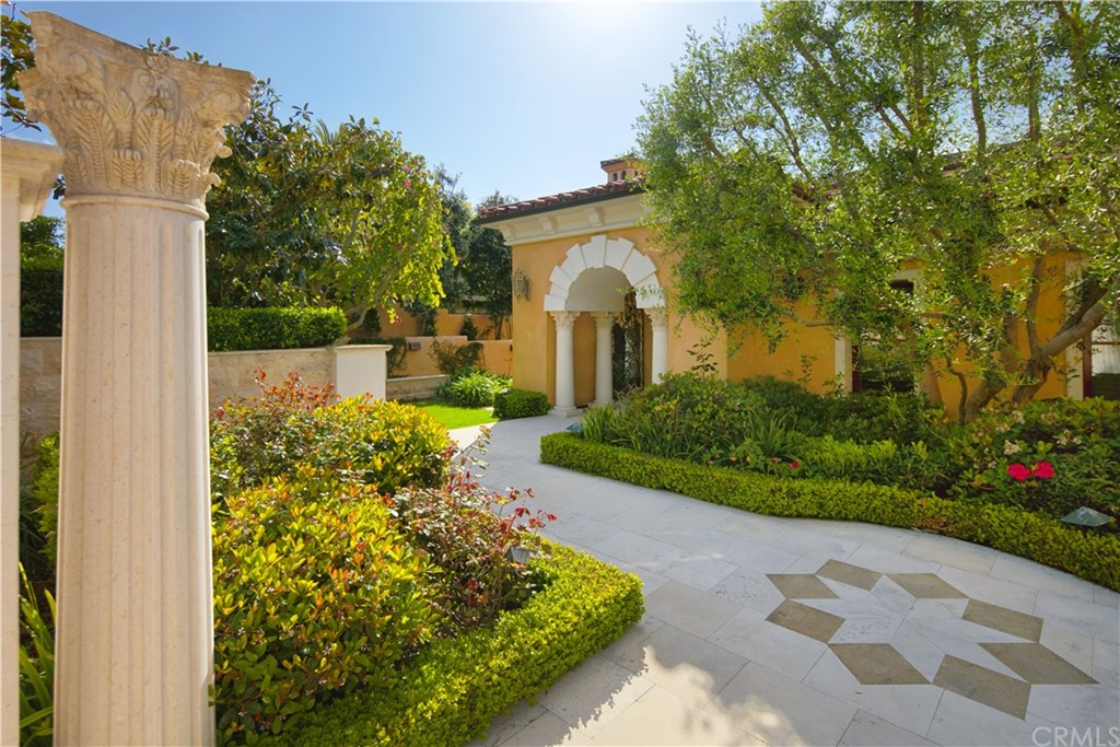 3 Tidecrest Newport Coast, CA 92657 - Photo 7 of 37 a front view of a house with a yard and fountain