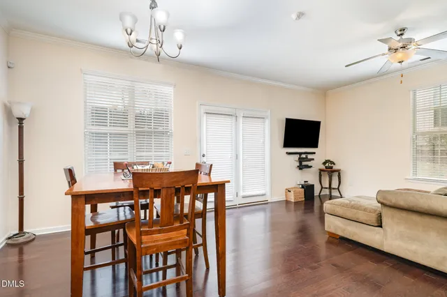 a living room with furniture window and a flat screen tv