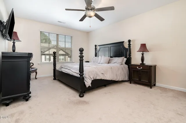 a kitchen with a sink stove cabinets and wooden floor