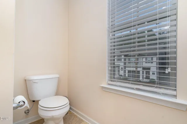 a white bath tub sitting next to a shower