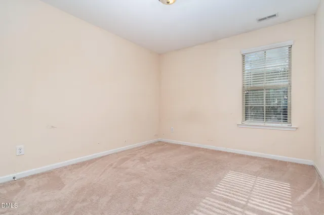 a bathroom with a double vanity sink a mirror and shower
