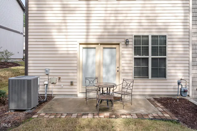 a bathroom with a sink a toilet and shower curtain