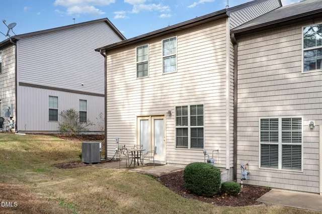 a view of a patio with table and chairs and wooden floor