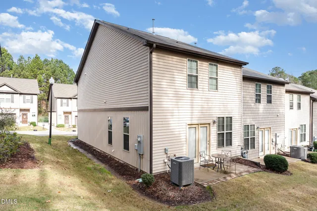 a front view of a house with outdoor seating