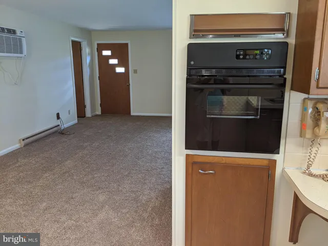 a kitchen with a stove and a microwave
