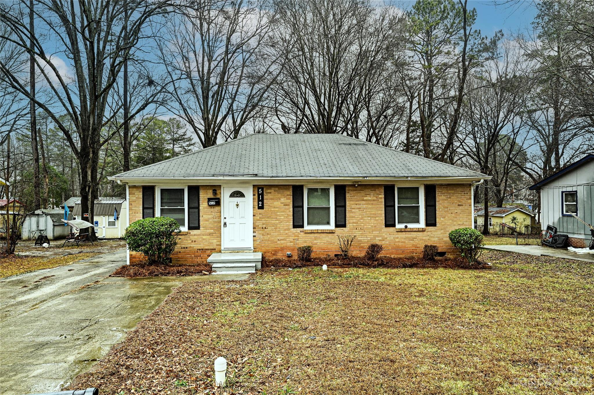 512 West Robinson Street Dallas, NC 28034 - Photo 1 of 17 a front view of a house with a yard