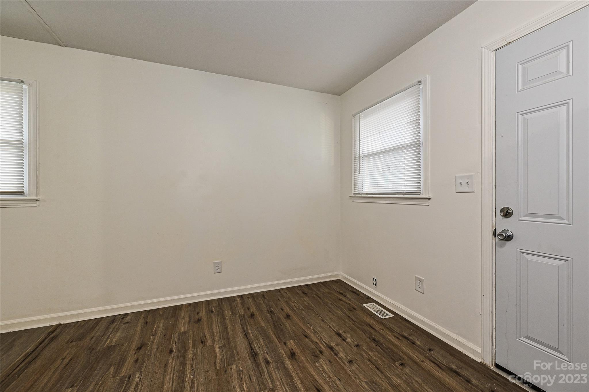 512 West Robinson Street Dallas, NC 28034 - Photo 3 of 17 a view of a room with wooden floor and window