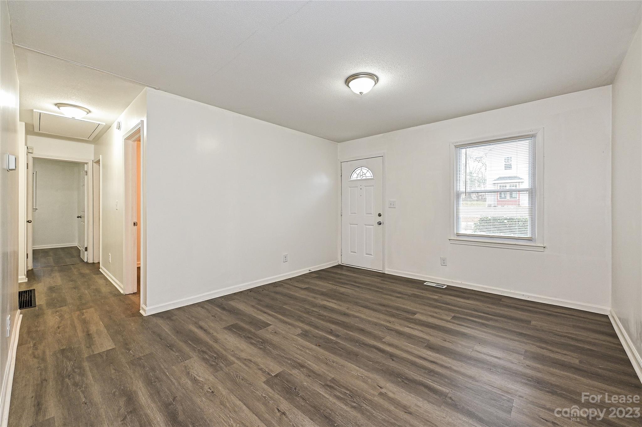 512 West Robinson Street Dallas, NC 28034 - Photo 5 of 17 a view of an empty room and wooden floor