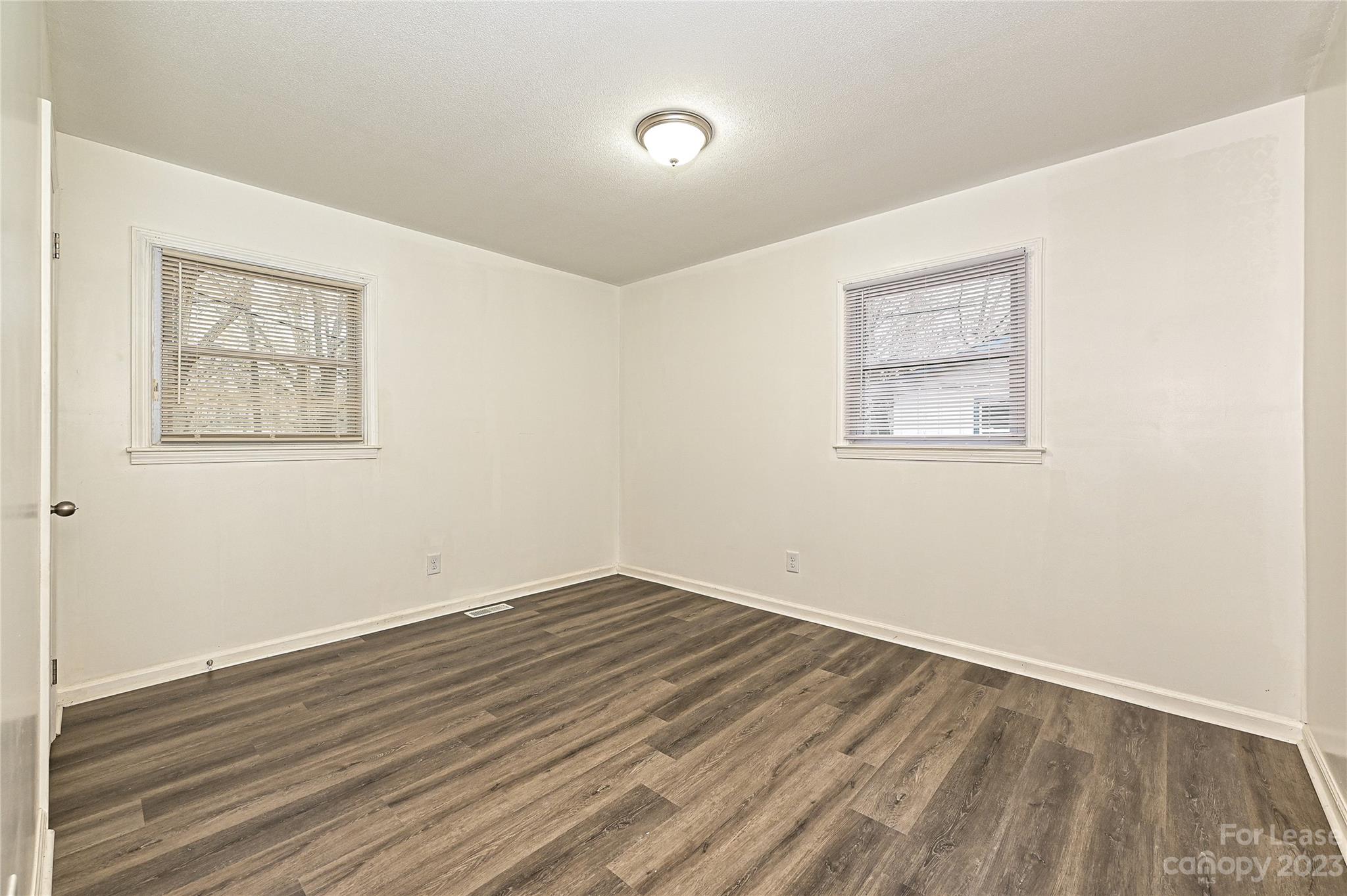 512 West Robinson Street Dallas, NC 28034 - Photo 6 of 17 a view of room with wooden floor and window