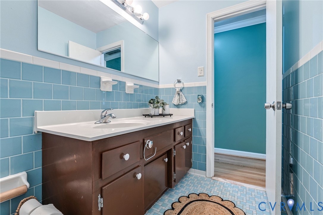 5904 Sutherland Drive Sutherland, VA 23885 - Photo 12 of 20 a bathroom with a sink a mirror and a shower