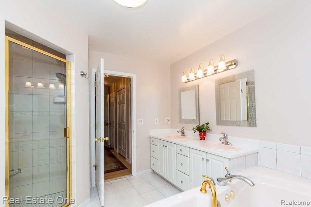 3815 Orion Road Oakland, MI 48363 - Photo 15 of 36 Master has Walk-in Shower, Walk-in 12x6 Closet and additional 9 ft Hall Closet.