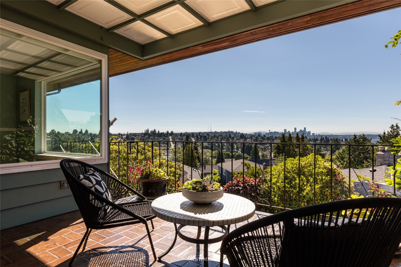a view of a chairs and table in patio