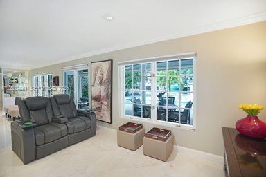 113 South Gordon Road Fort Lauderdale, FL 33301 - Photo 12 of 53 a living room with furniture and a floor to ceiling window