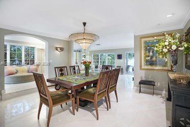 113 South Gordon Road Fort Lauderdale, FL 33301 - Photo 19 of 53 a view of a dining room with furniture a livingroom and chandelier