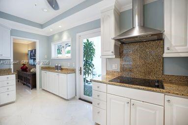 113 South Gordon Road Fort Lauderdale, FL 33301 - Photo 23 of 53 a kitchen with a sink stove and cabinets