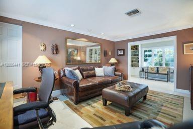 113 South Gordon Road Fort Lauderdale, FL 33301 - Photo 27 of 53 a living room with furniture and a large window