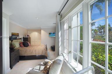113 South Gordon Road Fort Lauderdale, FL 33301 - Photo 31 of 53 a bedroom with furniture and a large window