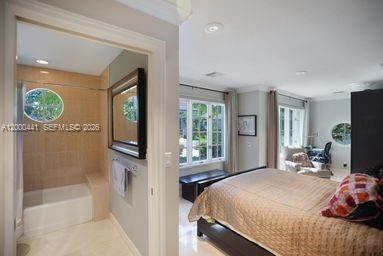 113 South Gordon Road Fort Lauderdale, FL 33301 - Photo 32 of 53 a bedroom with a bed mirror and window