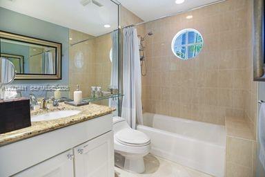 113 South Gordon Road Fort Lauderdale, FL 33301 - Photo 33 of 53 a bathroom with a granite countertop sink toilet and shower